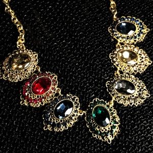 Multi faceted, multi color necklace.